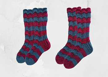 Openwork striped socks with knitting needles