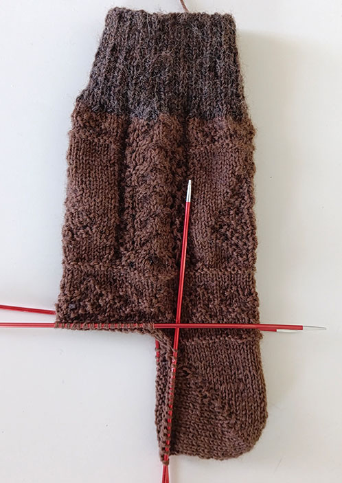 Socks with a boomerang heel